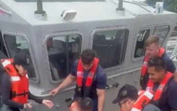 U.S. Coast Guard, Guam Fire Department rescue 45 people from boat off Agat, Guam