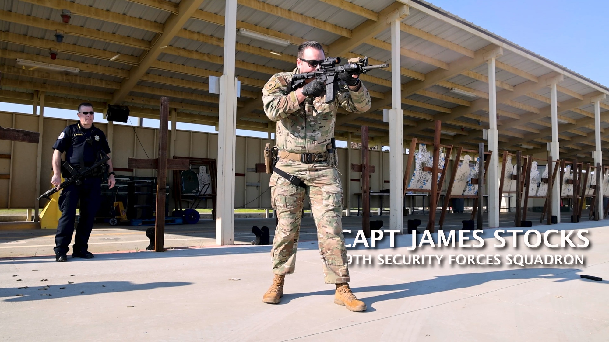 U.S. Air Force Capt. James Stocks, 9th Security Forces Squadron, is joined at the firing range by his honorary commander, Brian Wittmer, Wheatland Police Department Chief. Together, they practice their marksmanship and discuss the mutual benefits of the honorary commander program.