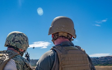 Parallax motion photo of Seabees conducting crew-served weapons training with M203 grenade launcher