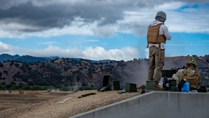 Parallax motion photo of Seabees conducting crew-served weapons training utilizing an M2 machine gun