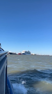 Coast Guard Small Boat Crew Watches Helicopter Fly Over