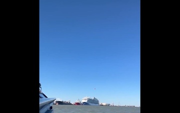 Coast Guard Small Boat Crew Watches Helicopter Fly Over