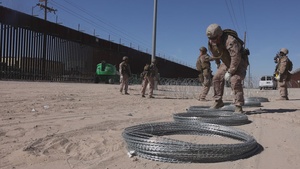 JTF-SB Marines prep concertina wire for installation (B-Roll)