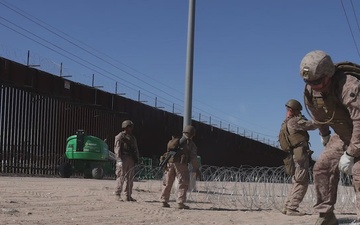 JTF-SB Marines prep concertina wire for installation (B-Roll)