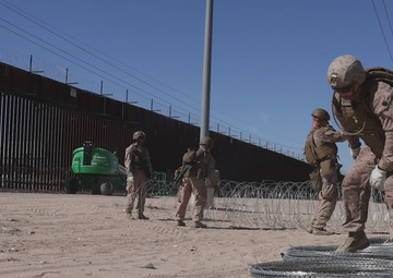 JTF-SB Marines prep concertina wire for installation (B-Roll)