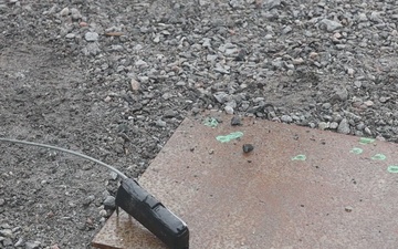 U.S. Marine explosive ordnance disposal technicians execute an experimental demolition range