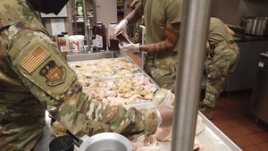 169th Force Support Squadron Airmen prepare and serve lunch at the DFAC