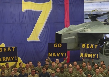 SECNAV cheers for the USNA Midshipmen while aboard USS Iwo Jima