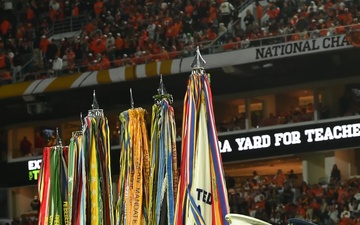 Coast Guard Air Station Miami conducts a military flyover for College Football National Championship game