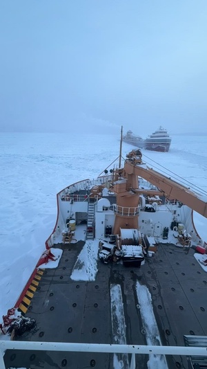 Coast Guard Cutter Mackinaw (WLBB 30) frees vessel from ice on Lake Huron