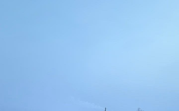 Coast Guard Cutter Mackinaw (WLBB 30) frees vessel from ice on Lake Huron