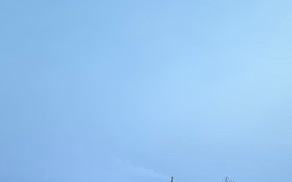 Coast Guard Cutter Mackinaw (WLBB 30) frees vessel from ice on Lake Huron