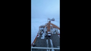 Coast Guard Cutter Mackinaw (WLBB 30) frees vessel from ice on Lake Huron