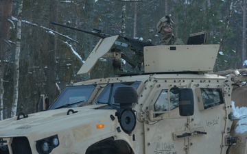 U.S. Soldiers train with M2A3 Bradleys during platoon STX in Poland