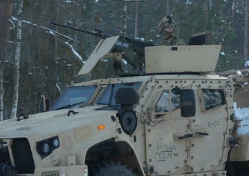 U.S. Soldiers train with M2A3 Bradleys during platoon STX in Poland