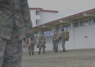Japan Self-Defense Force cadets provide combat casualty care during a TCCC course