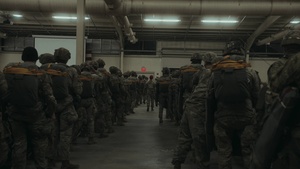 Paratroopers assigned to 2nd Battalion, 504th Parachute Infantry Regiment “White Devils," walk the flight line to board a CC-130J before an airborne operation during a deployment readiness exercise on Fort Bragg, North Carolina.