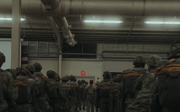 Paratroopers assigned to 2nd Battalion, 504th Parachute Infantry Regiment “White Devils”, walk the flight line to board a CC-130J before an airborne operation during a deployment readiness exercise on Fort Bragg, North Carolina.