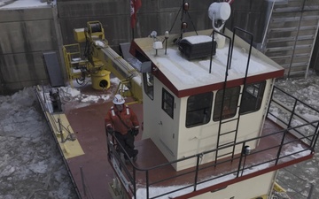 McAlpine personnel ensure safe navigation during freezing weather b-roll 4k