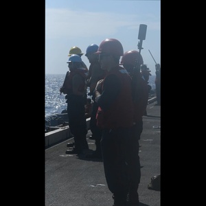 Abraham Lincoln conducts a replenishment-at-sea with Yukon