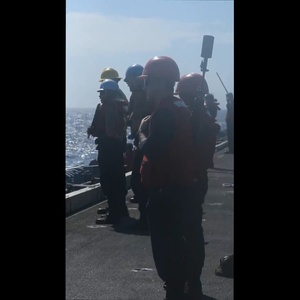 Abraham Lincoln conducts a replenishment-at-sea with Yukon