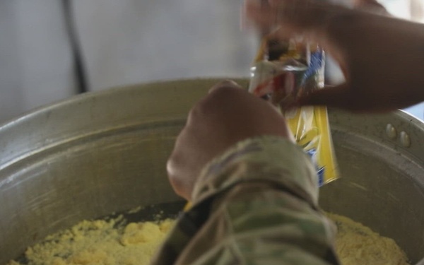 Dogface culinary specialists feed troops in the field