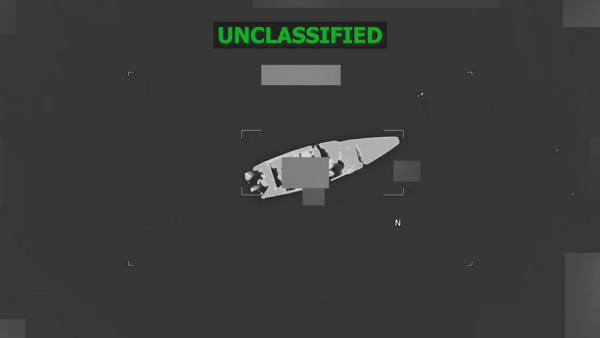 Black and white overhead video footage of a boat strike.