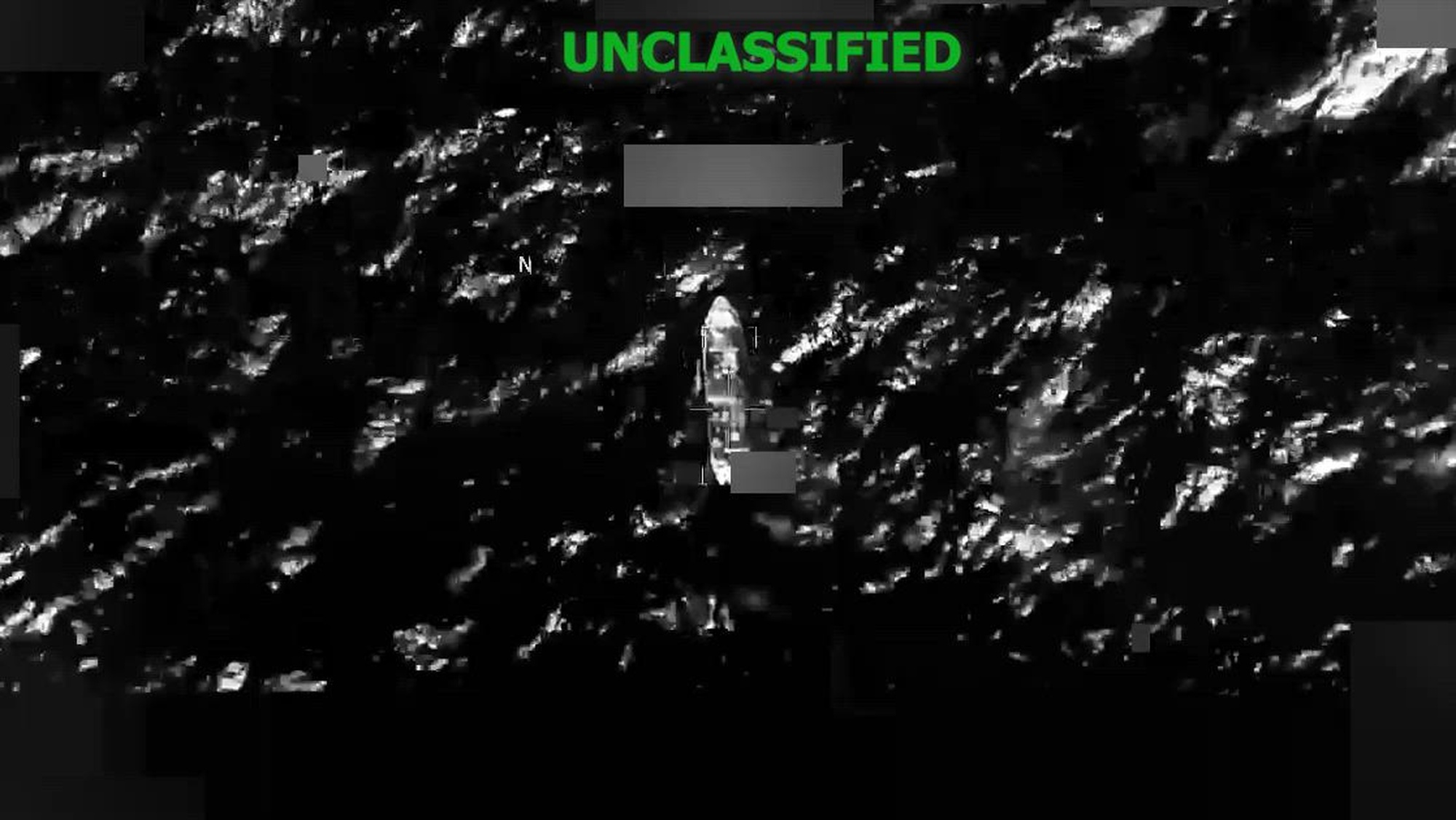 Black and white overhead video of a boat.