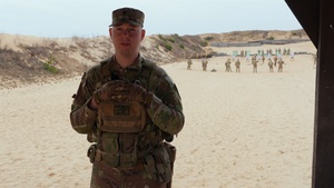 Spc. Bryan Williams discusses Schützenschnur qualification in Lithuania