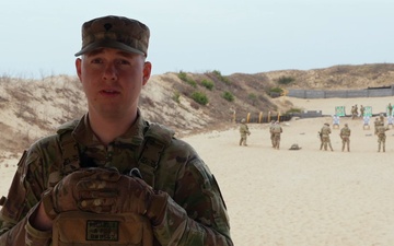 Spc. Bryan Williams discusses Schützenschnur qualification in Lithuania