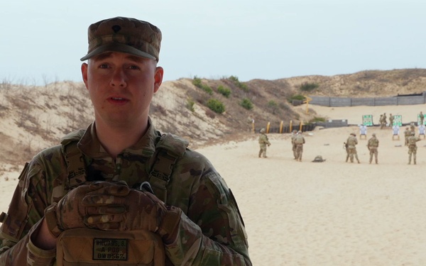 Spc. Bryan Williams discusses Schützenschnur qualification in Lithuania