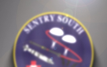 MA-9 Reaper loading AGM-114 Hellfire missile