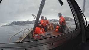 USCGC Polar Star (WAGB 10) supports the installation of a pier in McMurdo Station during Operation Deep Freeze 2026