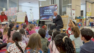 Under Secretary Anthony J. Tata Reads "Lil’ Marine" to Excited First-Graders at DoWEA Americas Crossroads Elementary School