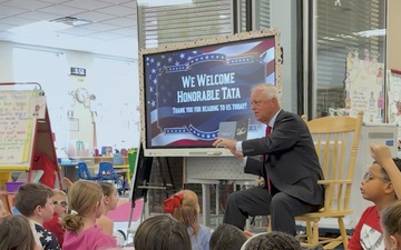 Under Secretary Anthony J. Tata Reads "Lil’ Marine" to Excited First-Graders at DoWEA Americas Crossroads Elementary School