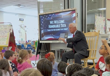 Under Secretary Anthony J. Tata Reads "Lil’ Marine" to Excited First-Graders at DoWEA Americas Crossroads Elementary School