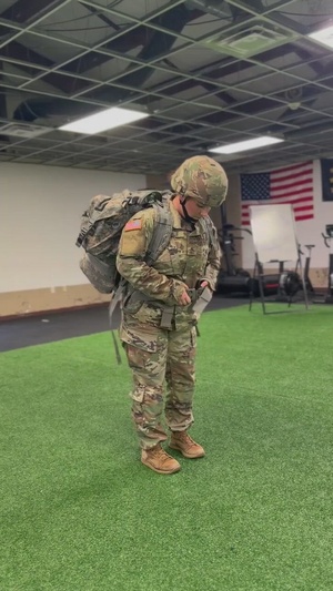 Indiana National Guard H2F coach demonstrates proper ruck packing techniques at Camp Atterbury
