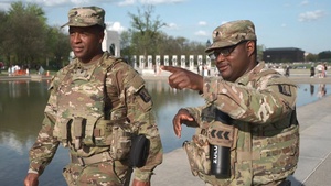 Mississippi National Guardsmen help a civilian that experienced a seizure at the Lincoln Memorial Reflecting Pool
