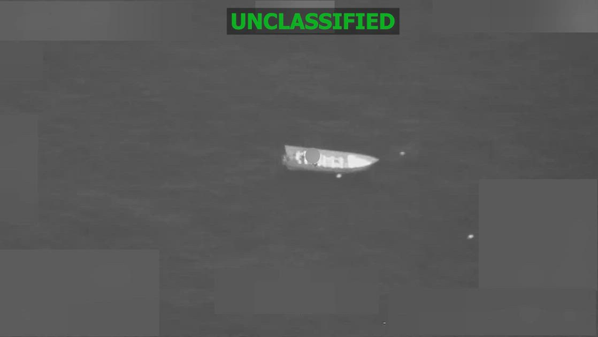 Black and white overhead video of a boat.