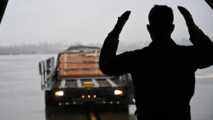 103d Aircrew loads cargo while conducting joint airborne training with 160th Special Operations