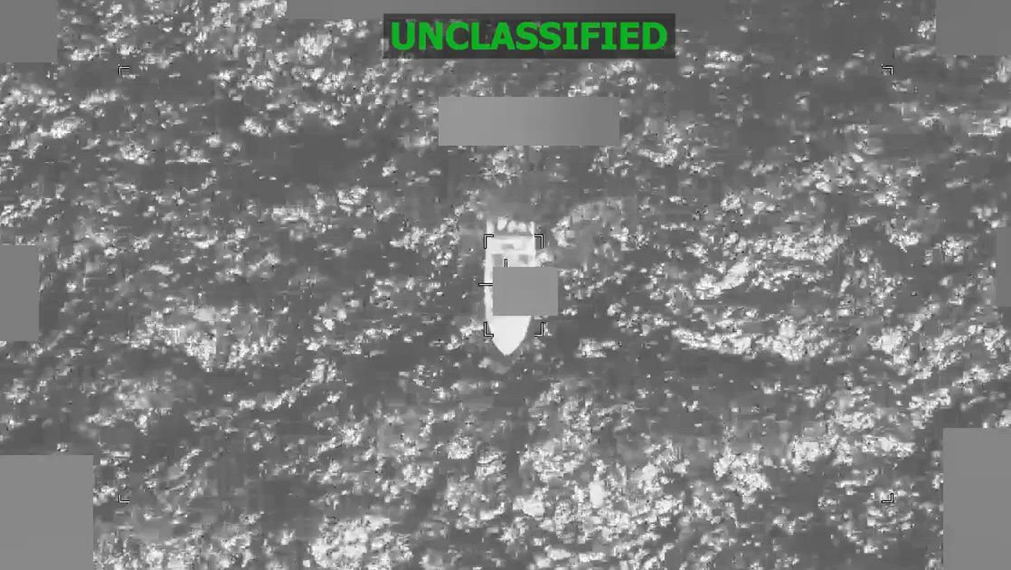 Black and white overhead video of a boat.