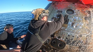 U.S. Navy Dive Medical Team Open the Orion Spacecraft