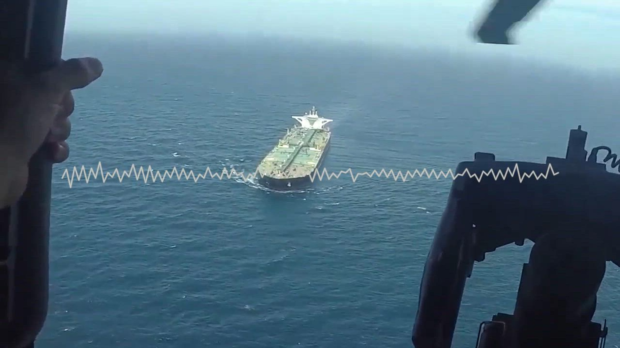 Audio of a Sailor aboard USS Michael Murphy (DDG 112), with video from the guided-missile destroyer’s embarked helicopter flying over the Gulf of Oman, as the U.S. Navy diverts a merchant vessel while enforcing the blockade on ships entering or departing Iranian ports. (U.S. Central Command Public Affairs video)