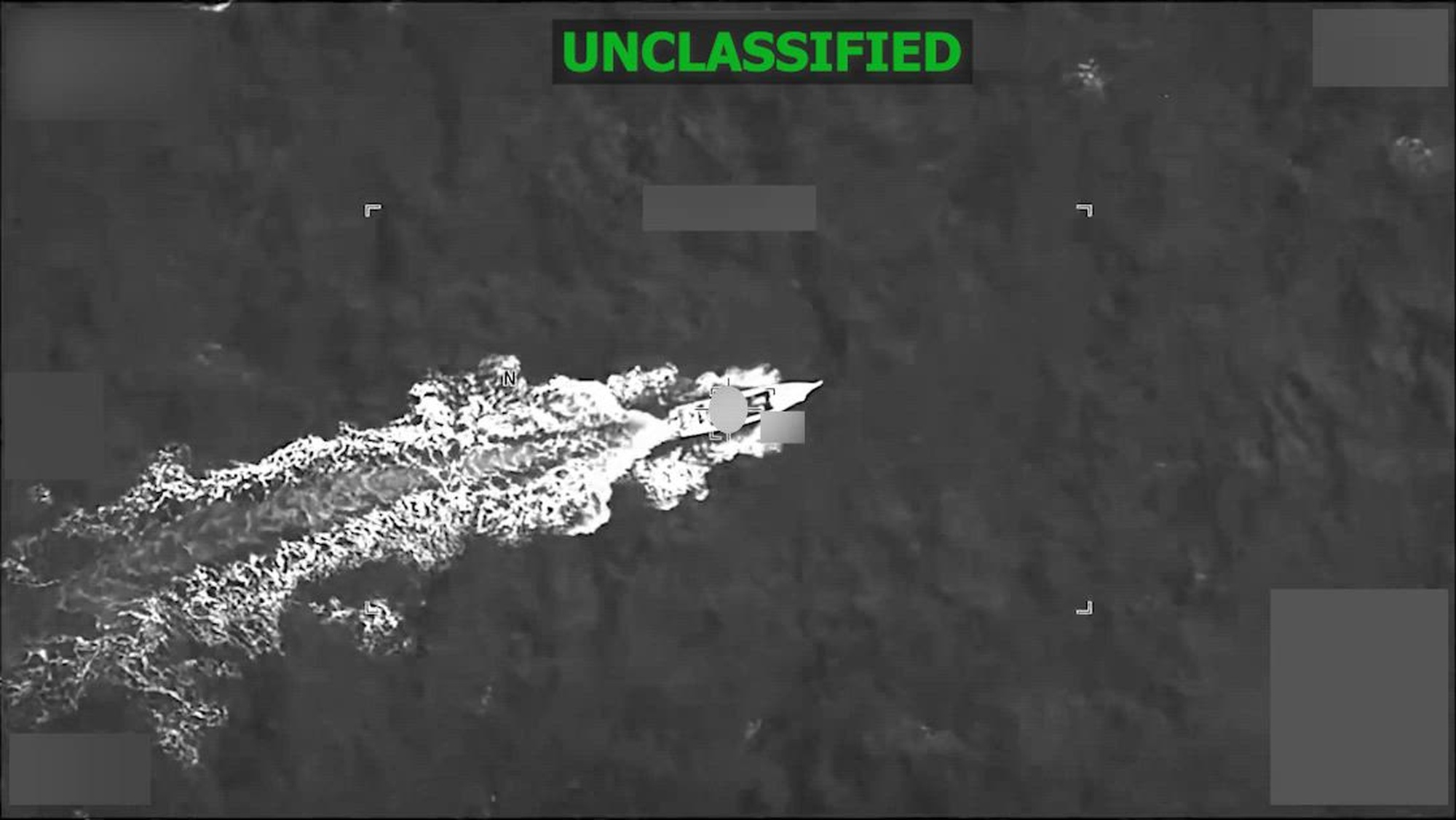 Black and white overhead footage of a boat.