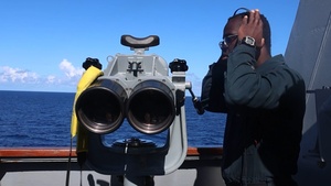 USS John Finn (DDG 113) Sailor stands watch