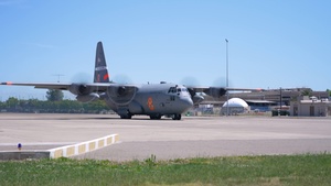 B-roll of Air National Guard and CAL FIRE C-130 Aircraft Taxiing, Landing, Taking Off, and Conducting Water Drop