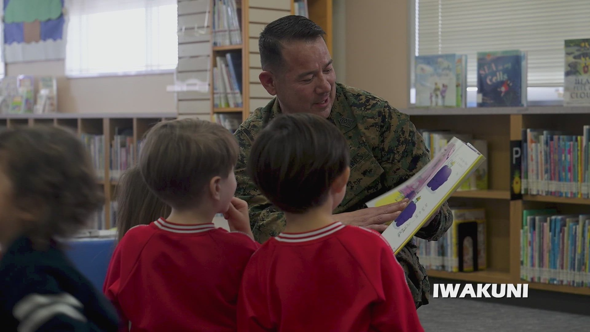 Sgt. Maj. Richard Johnson, Sgt. Maj. of Marine Corps Air Station Iwakuni, volunteers to read books to children as part of the base library's Month of the Military Child recognition program on MCAS Iwakuni, Japan, April 15, 2026. The Month of the Military Child is observed in April to honor the contributions of military children while recognizing the unique challenges faced by military families. (U.S. Navy video by MC2 Jeffrey Kempton)