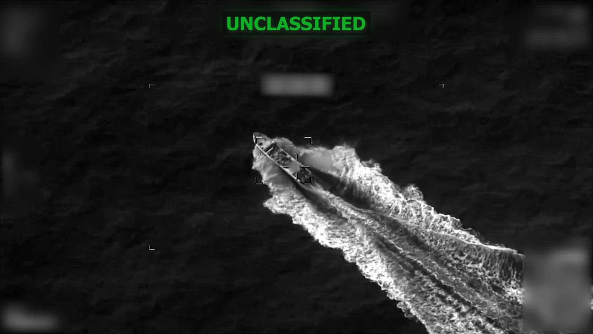 Black and white overhead footage of a boat.