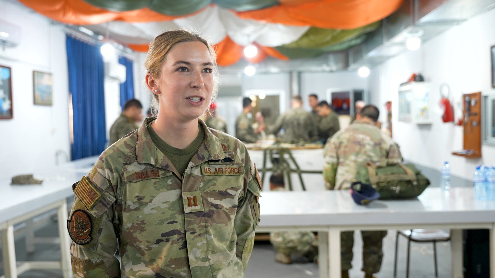 U.S. Air Force Capt. Virginia Walsh, assigned to the 435th Contingency Response Support Squadron, speaks about air rigging training with the 21st Air Unit in Bizerte, Tunisia, April 21, 2026. African Lion 2026 (AL26) is U.S. Africa Command's largest annual joint exercise, designed to strengthen collective security capabilities of the U.S., African nations and global allies. Co-led by U.S. Army Southern European Task Force, Africa (SETAF-AF) from April 20 to May 8, 2026, and hosted in Ghana, Morocco, Senegal, Tunisia, AL26 involves over 5,600 personnel from more than 40 nations, using innovation to drive partner-led regional security. (U.S. Army video by Capt. Joseph Proctor)