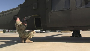 U.S. Army soldiers with JTF-SB conduct helicopter pre-flight check